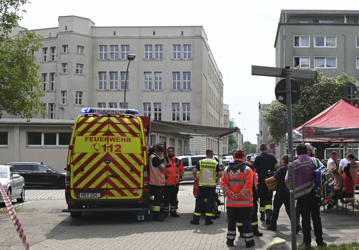 Emergency forces stand near a school in Bremerhaven, Germany, on May 19, 2022. (Sina Schuldt/dpa via AP)