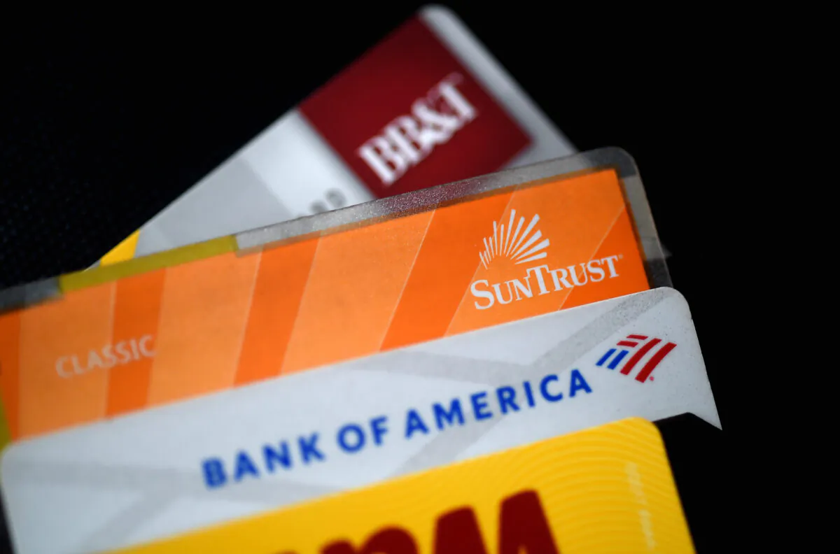 This illustration picture shows debit and credit cards arranged on a desk in Arlington, Virginia, on April 6, 2020. (Olivier Douliery/AFP via Getty Images)