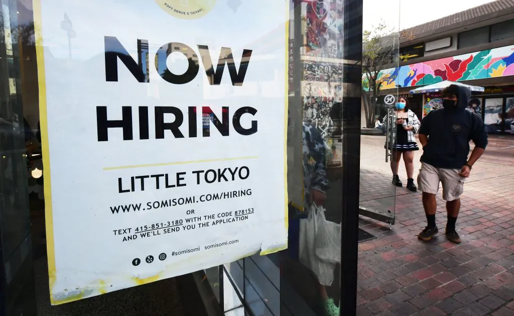A "now hiring" sign is posted in the window of an ice cream shop in Los Angeles, Calif., on Jan. 28, 2022. (Frederic J. Brown/AFP via Getty Images)