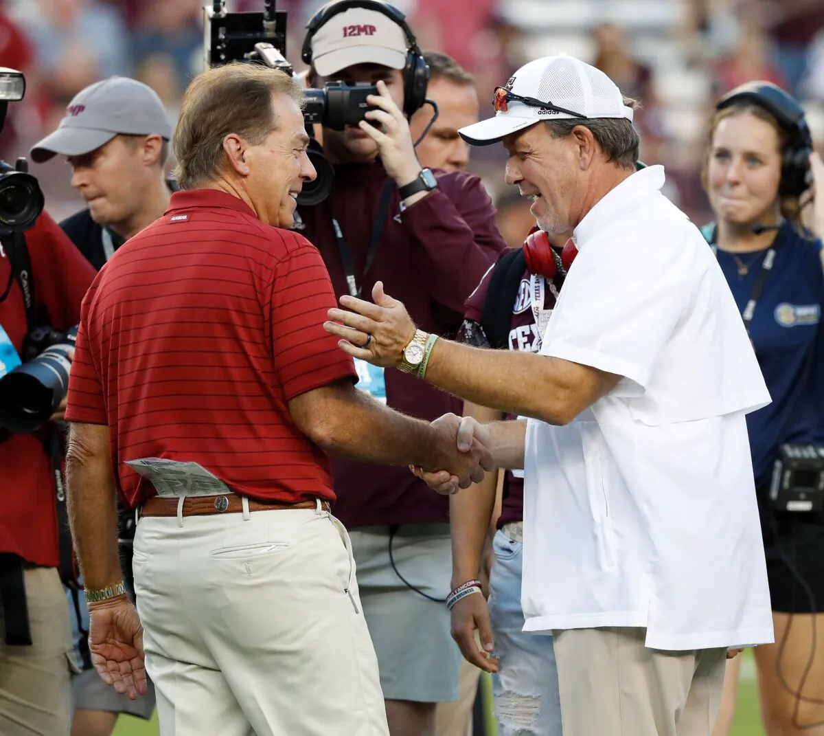 Head coach Nick Saban of the Alabama Crimson Tide and head coach Jimbo Fisher of the Texas A&M Aggies meet before the game at Kyle Field,in College Station, Texas, on October 9, 2021 . (Bob Levey/Getty Images)
