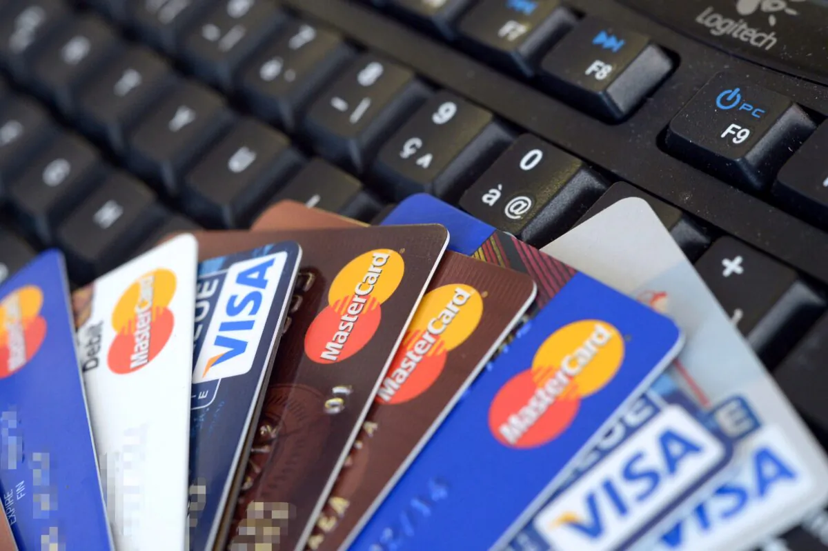 Credit cards falling down are pictured in Rennes, western France on Feb. 5, 2013. (Damien Meyer/AFP via Getty Images)