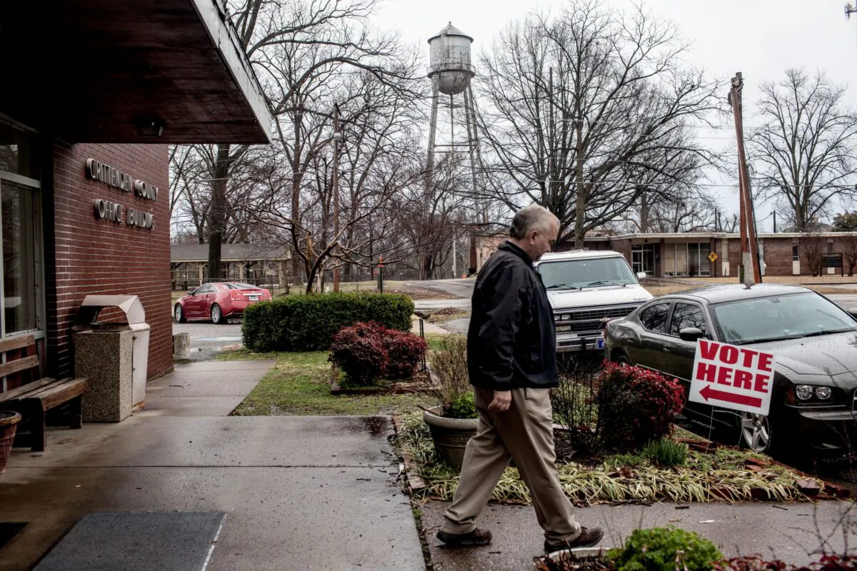 A voter walks out of the  polling location inside the Critteden County courthouse building after casting his ballot on March 1, 2016, in Marion, Arkansas. Arkansas has 40 Republican delegates and 32 Democratic delegates at stake in their primary. (Photo by Andrea Morales/Getty Images)