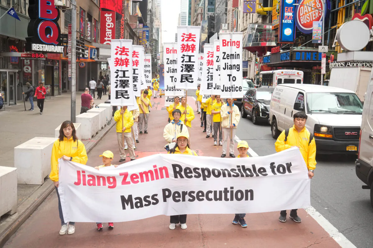 Falun Gong practitioners take part in a parade marking the 30th anniversary of the spiritual discipline's introduction to the public, in New York on May 13, 2022. (Larry Dye/The Epoch Times)