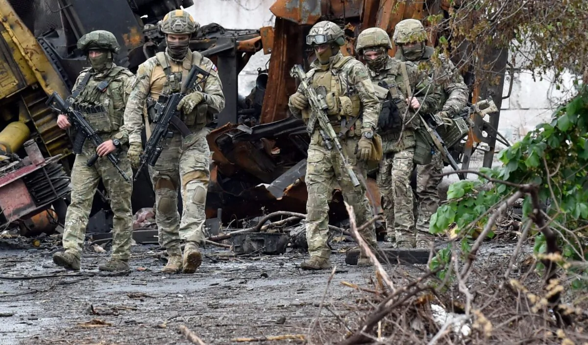 Russian servicemen patrol the destroyed part of the Ilyich Iron and Steel Works amid the ongoing Russian military action in Ukraine, in the port city of Mariupol, Ukraine, on May 18, 2022. (Olga Maltseva/AFP via Getty Images)