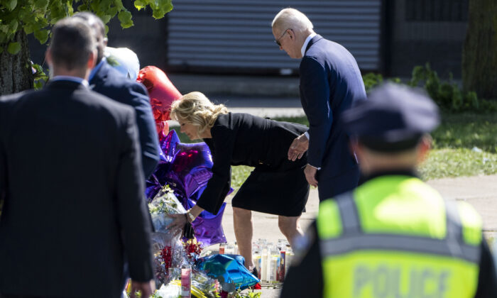Jill Biden places flowers at a memorial just across the street of the Tops Friendly Market at Jefferson Avenue and Riley Street in Buffalo, N.Y., on May 17, 2022. (Kent Nishimura/Los Angeles Times via TNS)