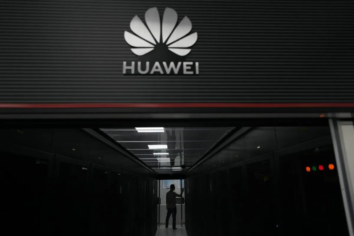 A technician stands at the entrance to a Huawei 5G data server center at the Guangdong Second Provincial General Hospital in Guangzhou, in southern China's Guangdong province on Sept. 26, 2021.(The Canadian Press/AP-Ng Han Guan)