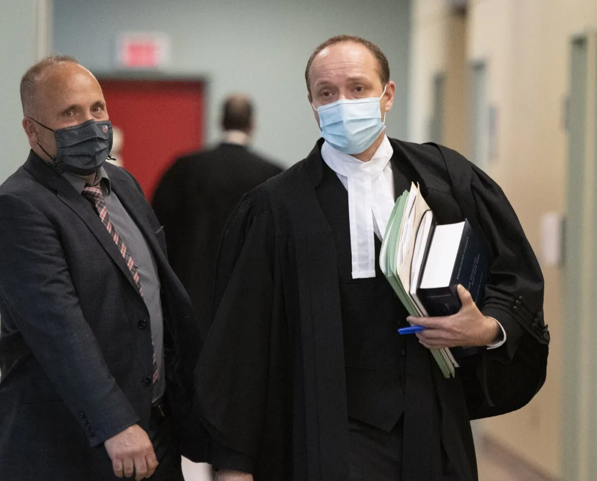 Quebec Crown prosecutor Francois Godin, right, walks to a courtroom, Nov. 5, 2020 in Quebec City. (The Canadian Press/Jacques Boissinot)
