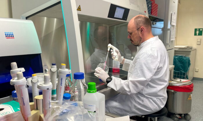 Head of the Institute of Microbiology of the German Armed Forces Roman Woelfel works in his laboratory in Munich, on May 20, 2022, after Germany has detected its first case of monkeypox.     (Christine Uyanik/Reuters)