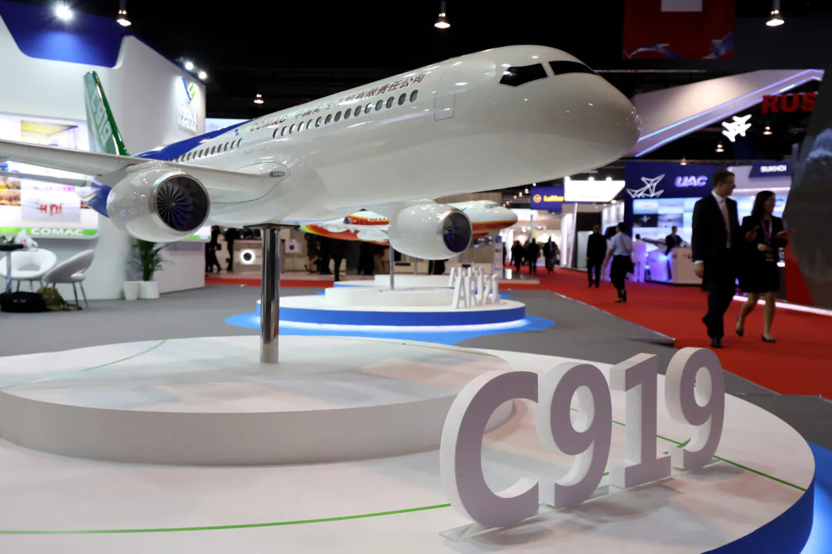 A model of the Commercial Aircraft Corp. of China Ltd. (Comac) C919 aircraft sits on display at the Singapore Airshow held at the Changi Exhibition Center in Singapore, on Feb. 6, 2018. The state-owned Chinese company seeks to chase markets in Asia and Africa. (Seong Joon Cho/Bloomberg via Getty Images)