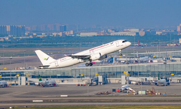 The first C919 large passenger aircraft to be delivered takes off from Shanghai Pudong International Airport in Shanghai, China, on May 14, 2022. The first C919 large passenger aircraft to be delivered completed a successful maiden test flight on May 14. (VGC/VCG via Getty Images)