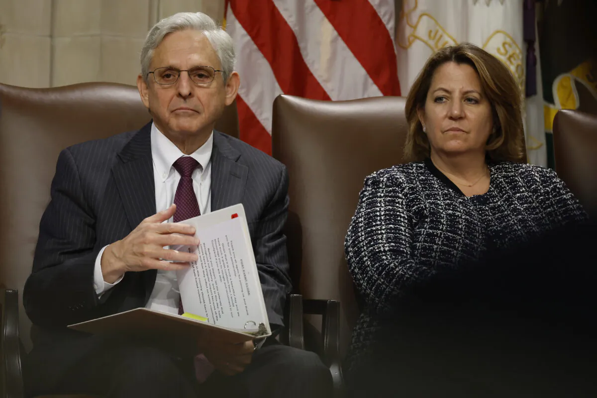 Attorney General Merrick Garland (L) and Deputy Attorney General Lisa Monaco attend an event marking the first anniversary of the COVID-19 Hate Crimes Act at the Department of Justice Robert F. Kennedy Building in Washington on May 20, 2022. (Chip Somodevilla/Getty Images)