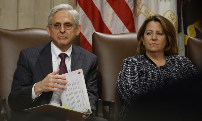 Attorney General Merrick Garland (L) and Deputy Attorney General Lisa Monaco attend an event marking the first anniversary of the COVID-19 Hate Crimes Act at the Department of Justice Robert F. Kennedy Building in Washington on May 20, 2022. (Chip Somodevilla/Getty Images)