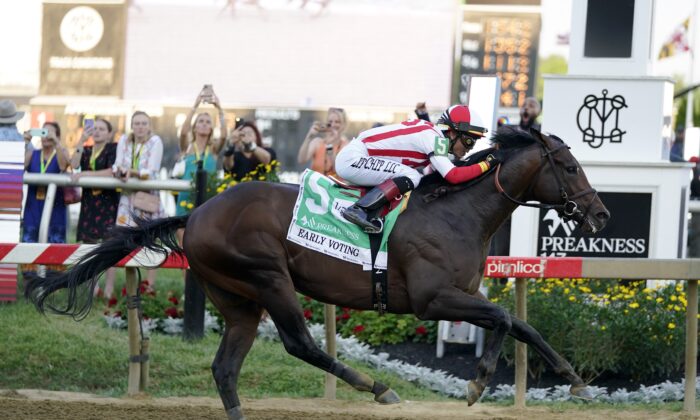 Jose Ortiz atop Early Voting wins the 147th running of the Preakness Stakes horse race at Pimlico Race Course in Baltimore on May 21, 2022. (Julio Cortez/AP Photo)