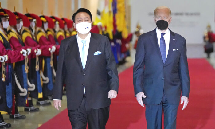 U.S. President Joe Biden and South Korean President Yoon Suk-yeol arrive at the National Museum of Korea for the state dinner, on May 21, 2022, in Seoul, South Korea. U.S. President Joe Biden is visiting South Korea for his first summit with his South Korean counterpart Yoon Suk-yeol, and the two leaders are expected to discuss a range of issues, including North Korea's nuclear program and supply chain risks. (Photo by Lee Jin-Man - Pool/Getty Images)