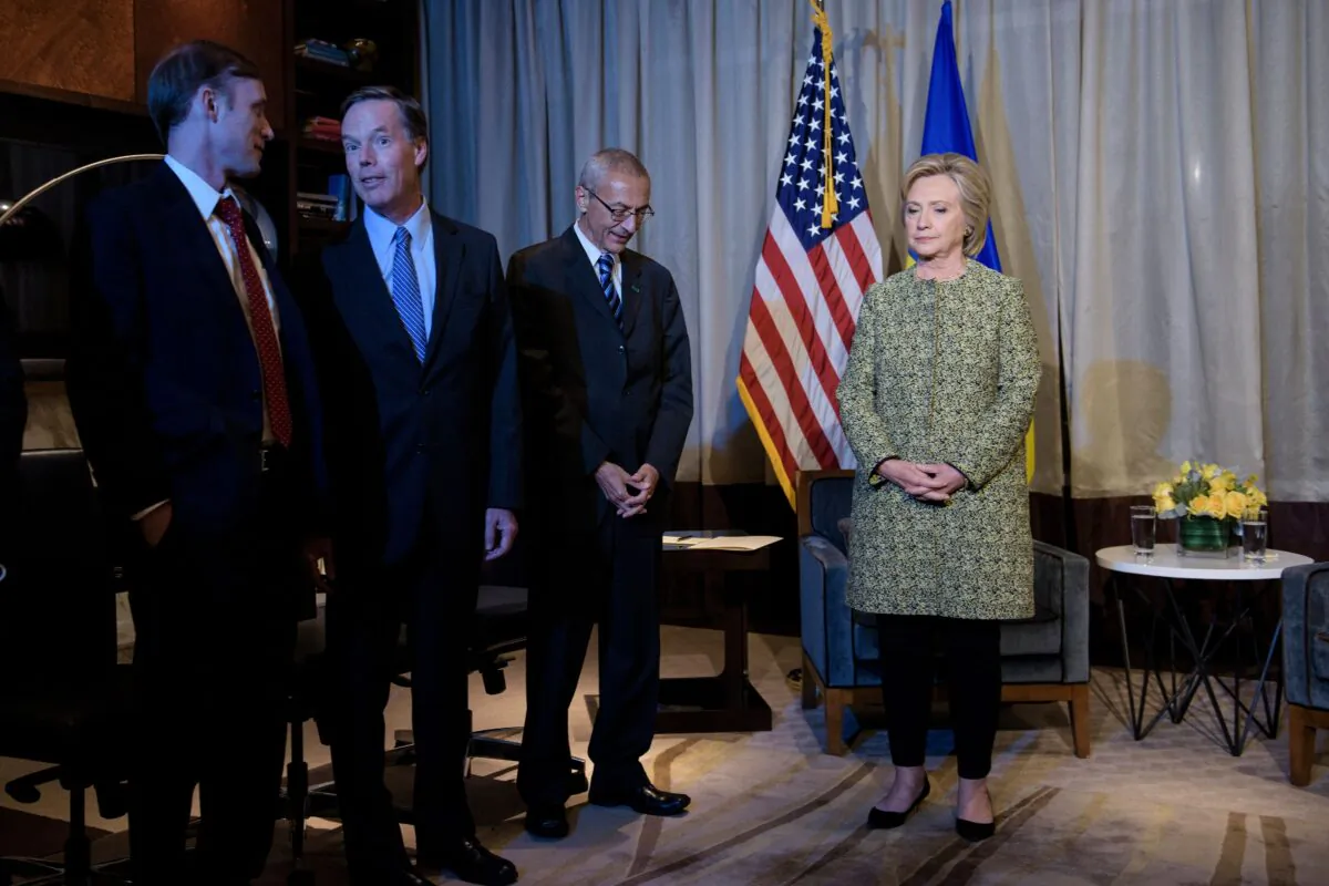Clinton advisors Jake Sullivan (L), Nick Burns (2L) and John Podesta (2R) wait with Democratic presidential nominee Hillary Clinton in New York on Sept. 19, 2016. (BRENDAN SMIALOWSKI/AFP via Getty Images)