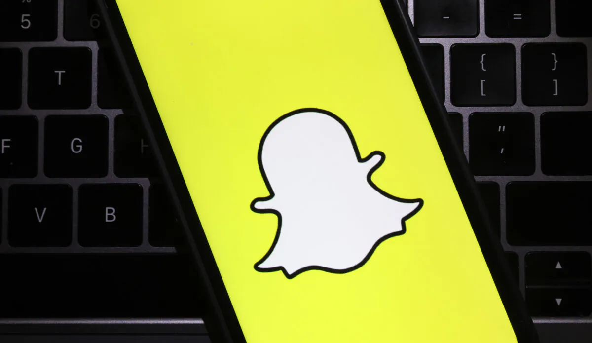 The Snapchat logo is displayed on a cell phone screen in San Anselmo, Calif., on Feb. 3, 2022. (Justin Sullivan/Getty Images)