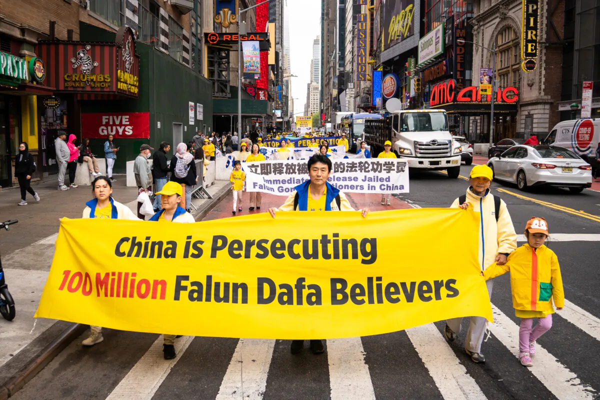 Falun Gong practitioners take part in a parade marking the 30th anniversary of the spiritual discipline's introduction to the public, in New York on May 13, 2022. (Samira Bouaou/The Epoch Times)