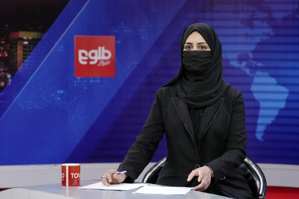 TV anchor Khatereh Ahmadi wears a face covering as she reads the news on TOLO NEWS, in Kabul, Afghanistan, on May 22, 2022. (Ebrahim Noroozi/AP Photo)