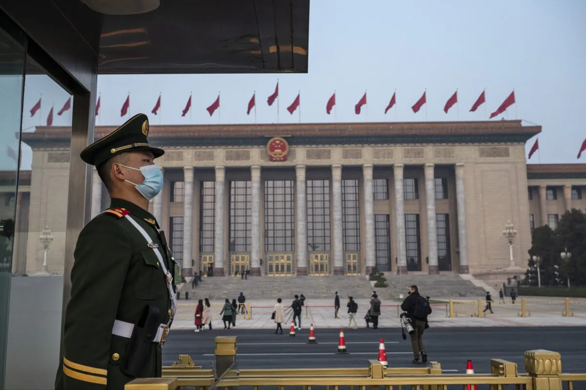 A police officer stands guard before the closing session of the Chinese People's Political Consultative Conference at the Great Hall of the People in Beijing, China, on March 10, 2022. (Kevin Frayer/Getty Images)