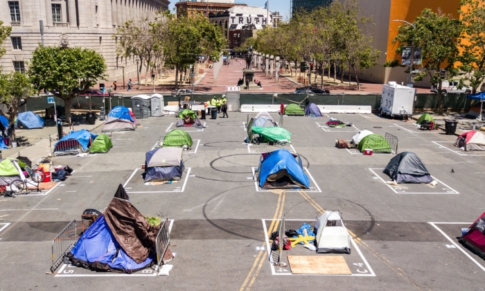 File photo: Rectangles are painted on the ground to encourage homeless people to keep social distancing at a city-sanctioned homeless encampment across from City Hall in San Francisco on May 22, 2020, amid the pandemic. (Josh Edelson/AFP via Getty Images)