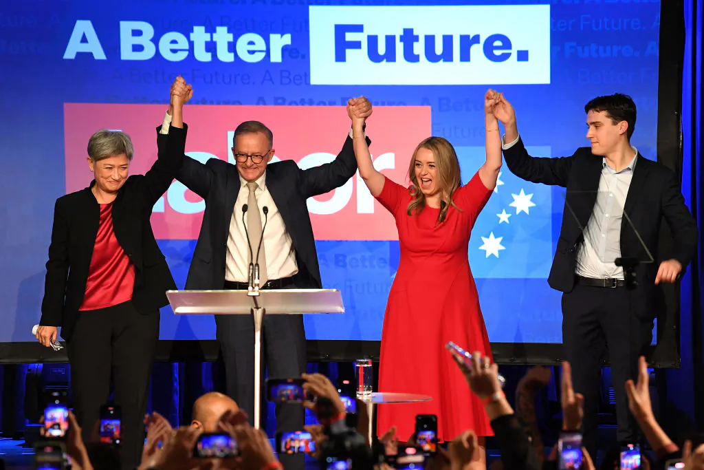 Incoming foreign affairs minister Senator Penny Wong, Labor Leader Anthony Albanese, his partner Jodie Haydon, and his son Nathan Albanese celebrate victory during the Labor Party election night event at Canterbury-Hurlstone Park RSL Club in Sydney, Australia, on May 21, 2022. (James D. Morgan/Getty Images)
