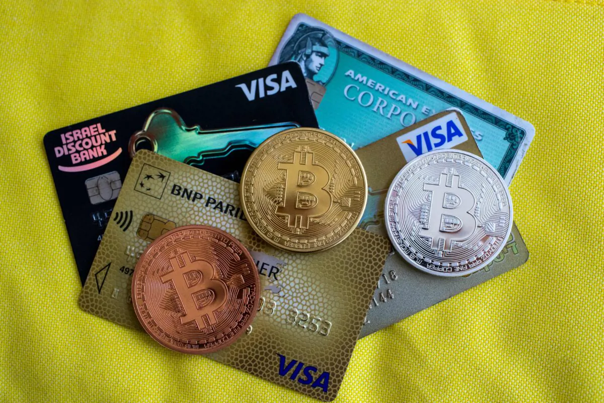 A picture shows a visual representation of the digital crypto-currency Bitcoin next to Visa cards, at the "Bitcoin Change" shop in the Israeli city of Tel Aviv on Feb. 6, 2018. (Jack Guez/AFP via Getty Images)