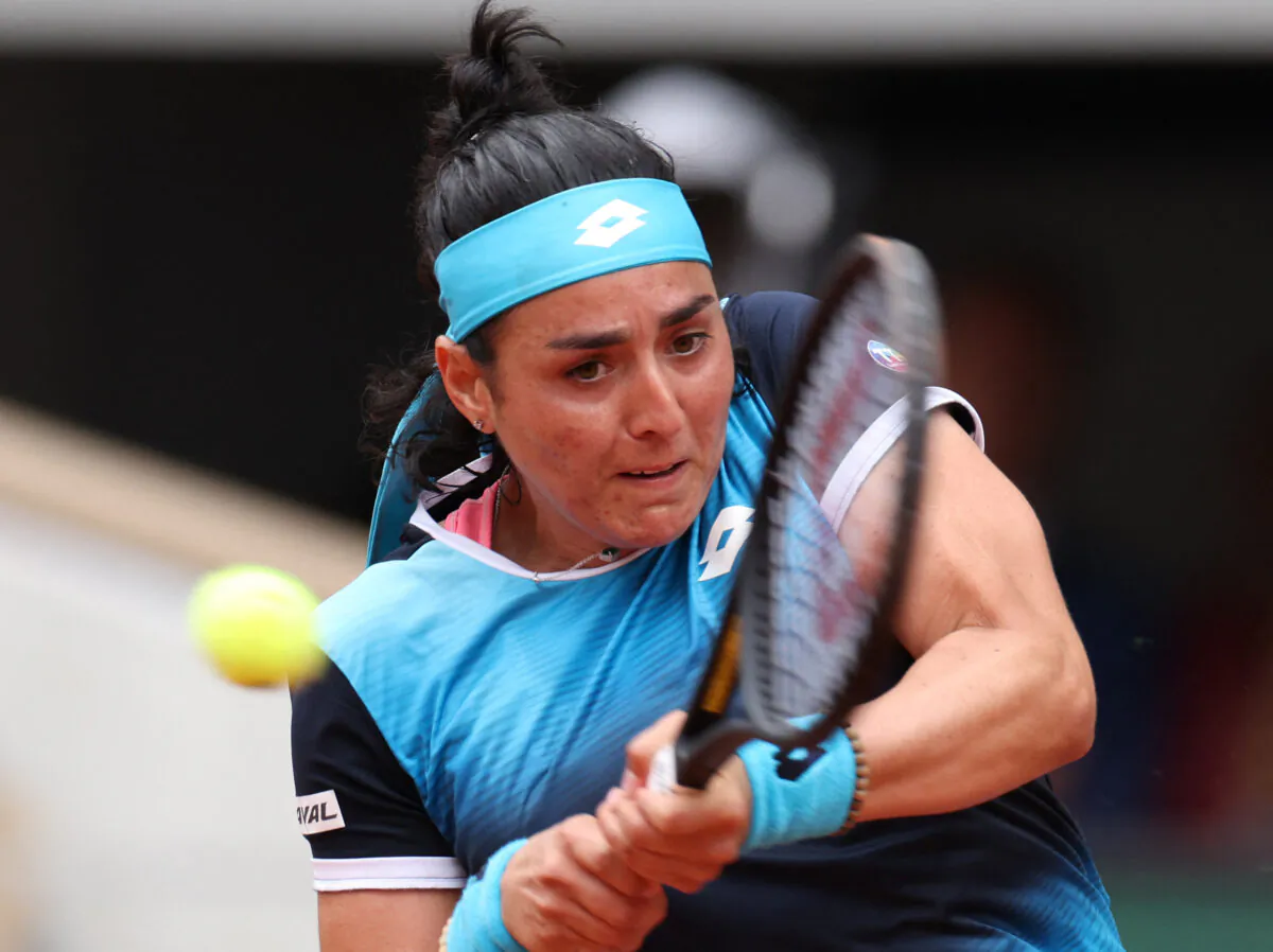 Tunisia's Ons Jabeur in action during her first round match against Poland's Magda Linette at the French Open in Paris on May 22, 2022. (Yves Herman/Reuters)