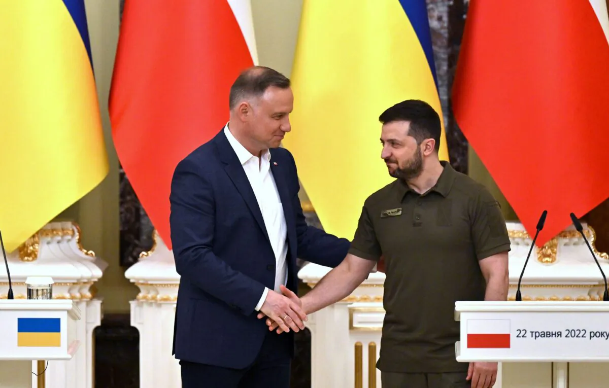 Ukrainian President Volodymyr Zelenskyy (R) and his Polish counterpart Andrzej Duda shake hands during a press conference following their talks in Kyiv, Ukraine, on May 22, 2022. (Sergei Supinsky/AFP via Getty Images)