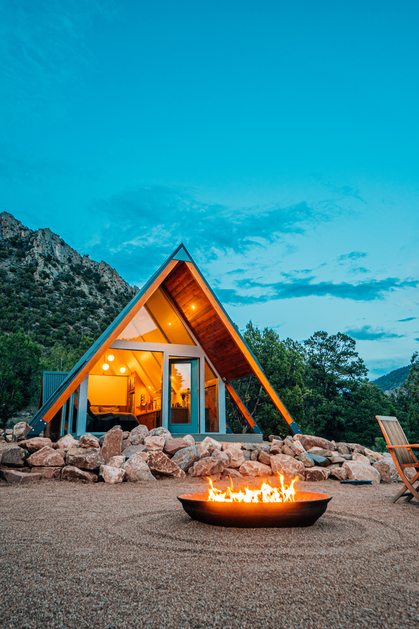 Wide Angle Shot of a Modern Tiny Home with a Cast Iron Firepit in Western Colorado at Dusk