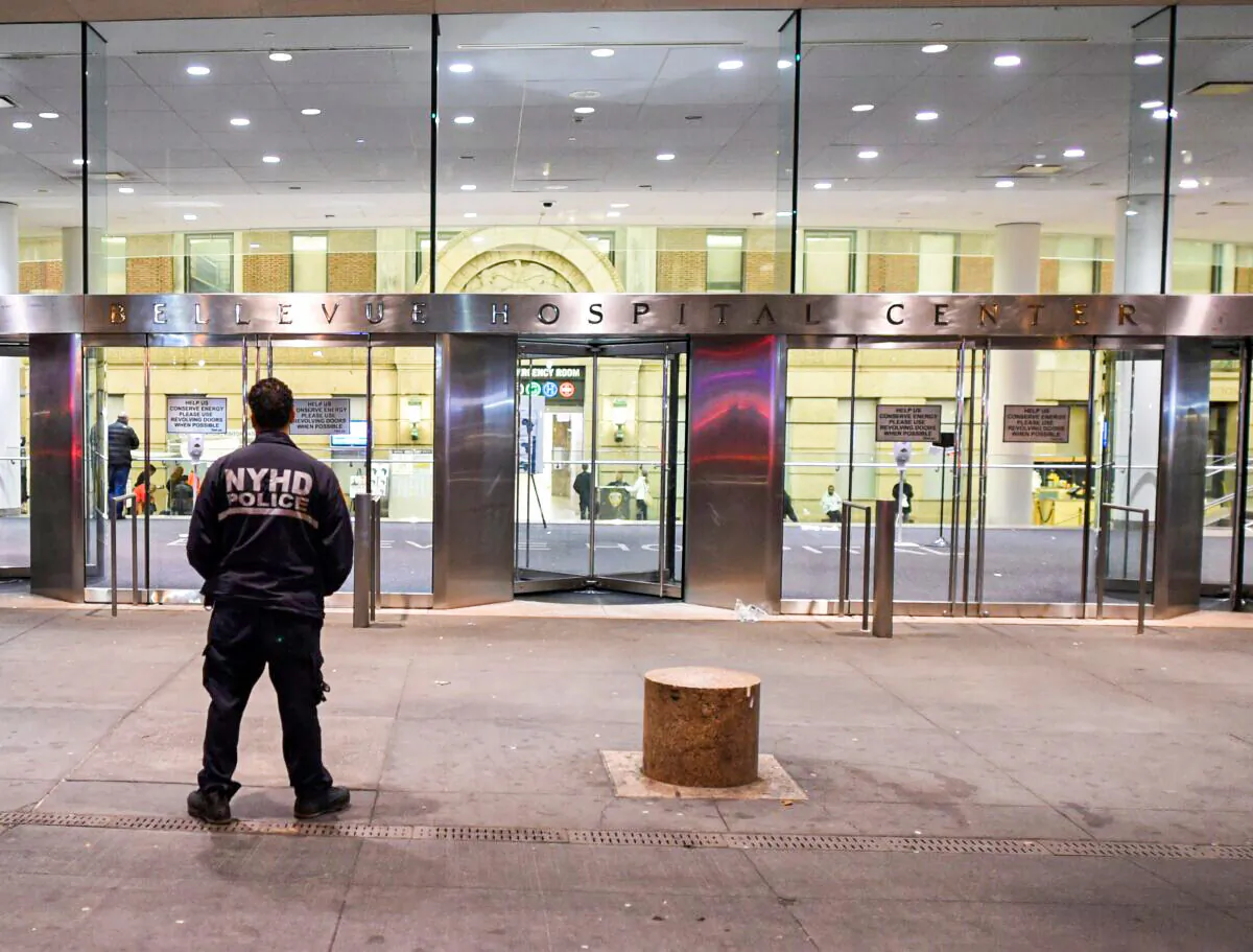A New York City Department of Health and Hospitals Police (NYHP) officer walks past the entrance to Bellevue  Hospital in New York on Oct. 23, 2014. (Timothy A. Clary/AFP via Getty Images)