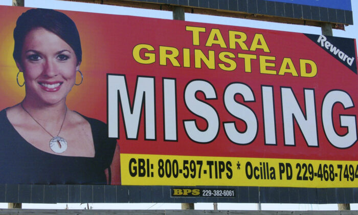 An image of Tara Grinstead is displayed on a billboard, a popular high school teacher who vanished in Ocilla, Ga., in 2005. (Elliott Minor/AP Photo)