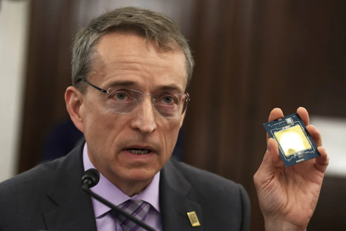 CEO of Intel Corporation Pat Gelsinger holds up a semiconductor as he testifies during a hearing before Senate Committee on Commerce, Science, and Transportation at Russell Senate Office Building on Capitol Hill in Wash., on March 23, 2022. (Alex Wong/Getty Images)