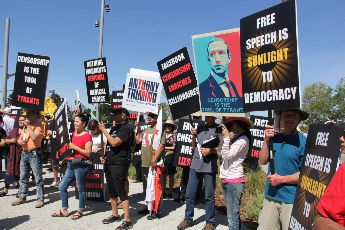 Protesters denounce Meta CEO Mark Zuckerberg at a May 2022 Humanity Against Censorship rally in front of Meta headquarters in Menlo Park, Calif. (Mrs. Hao/The Epoch Times)