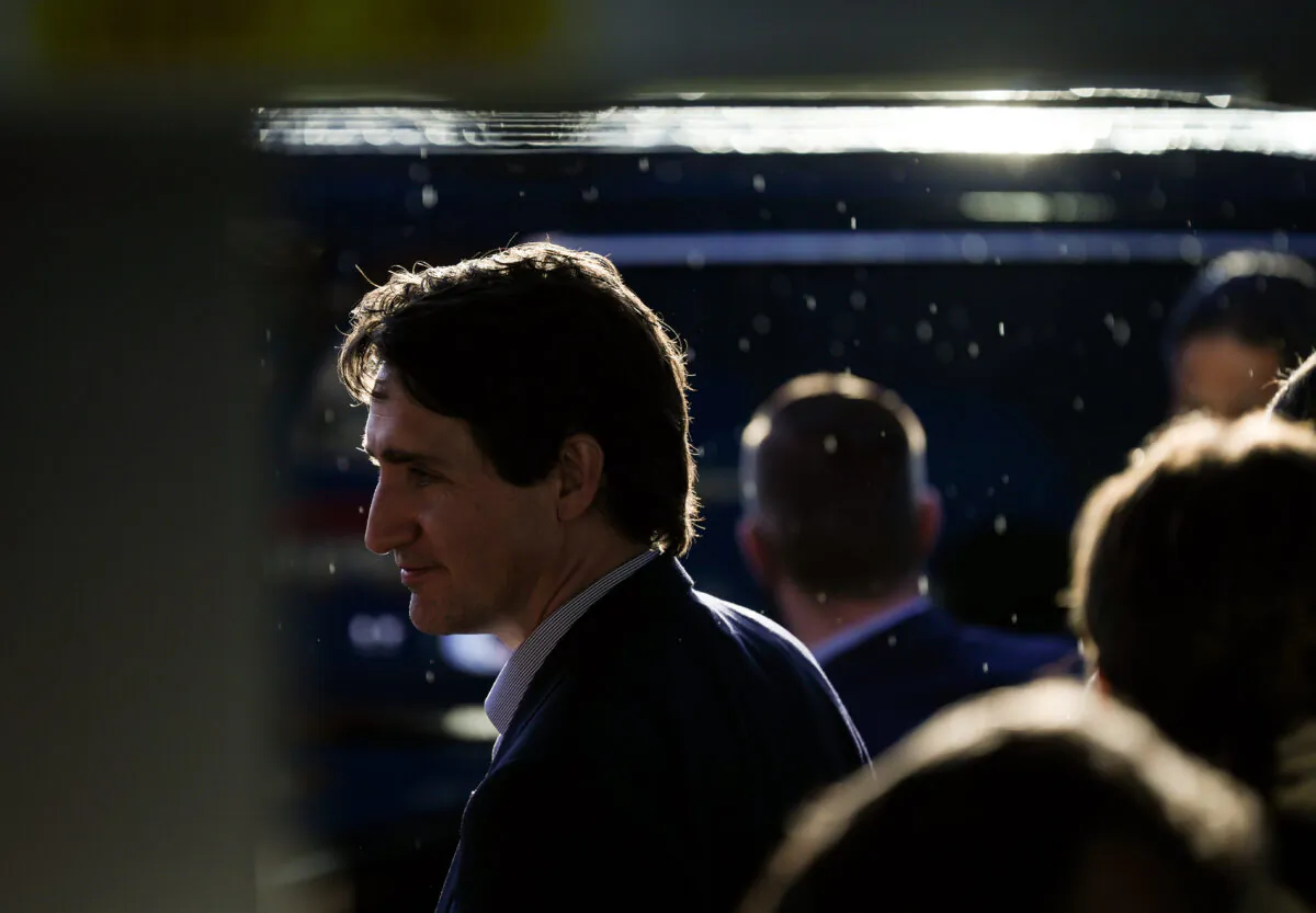 Light rain falls as Prime Minister Justin Trudeau leaves after a news conference in Kamloops, B.C., on May 23, 2022. (The Canadian Press/Darryl Dyck)