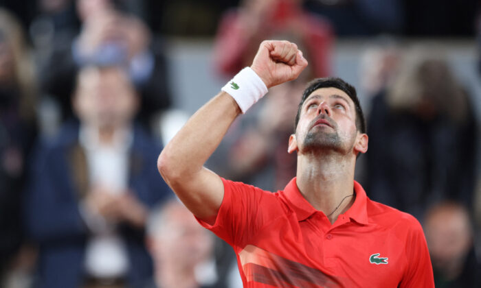 Serbia's Novak Djokovic celebrates after winning his first round match against Japan's Yoshihito Nishioka at the French Open tennis tournament in Roland Garros stadium in Paris on May 23, 2022. (Yves Herman/Reuters)