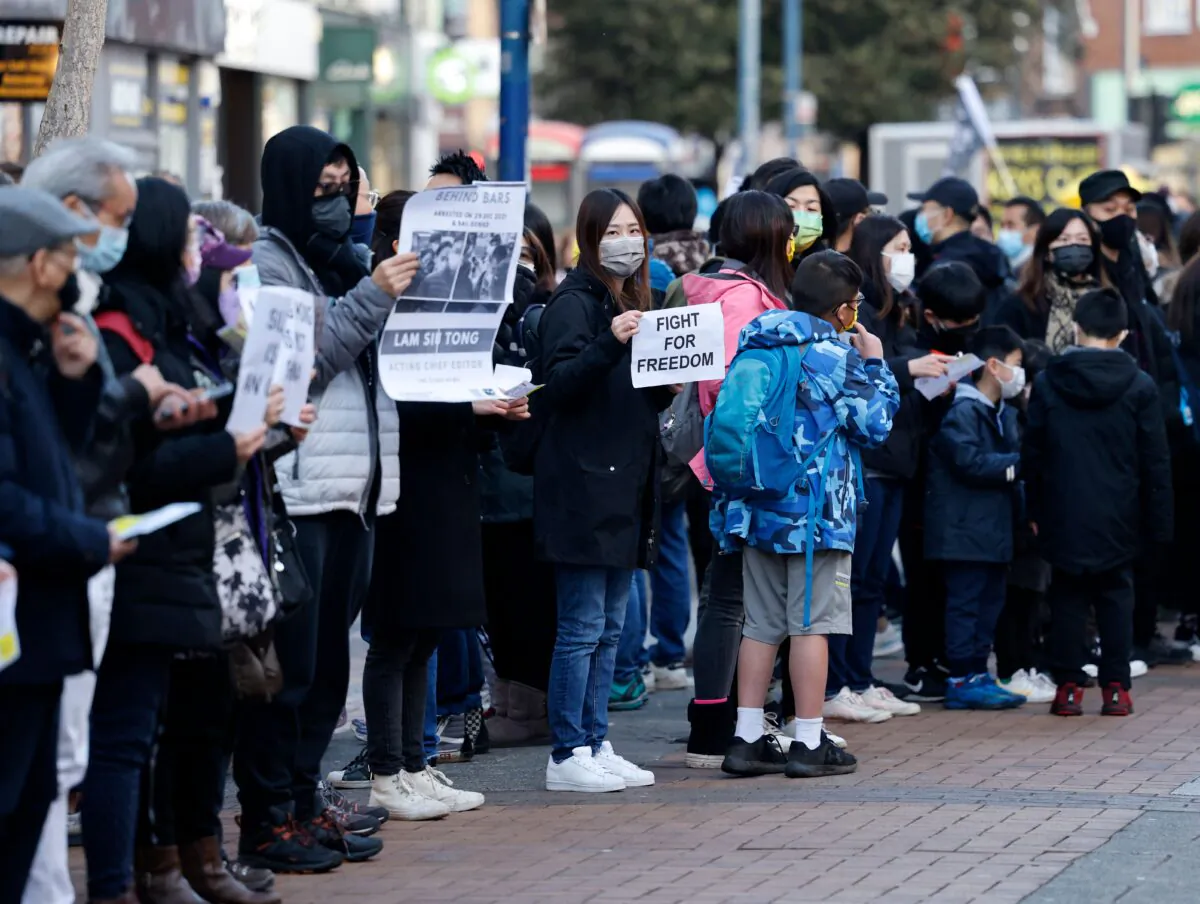 Protesters demonstrate against the "dramatic deterioration of press freedom" in Hong Kong as they gather in the center of Kingston upon Thames in south west London, on Jan. 9, 2022. (Tolga Akmen/AFP via Getty Images)