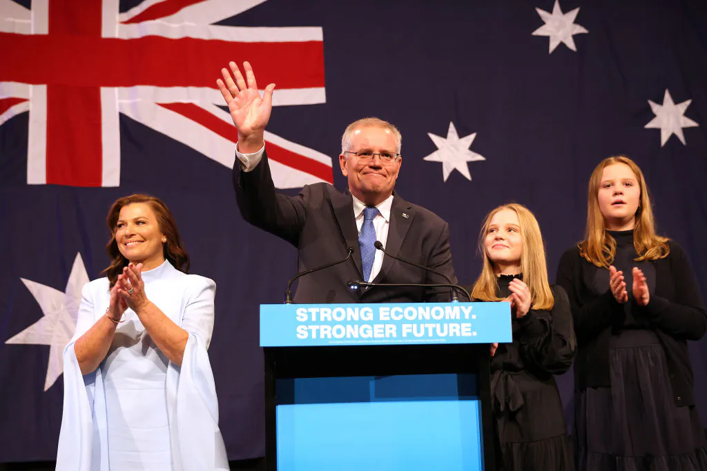 Former Prime Minister of Australia Scott Morrison, flanked by his wife Jenny Morrison and daughters Lily Morrison and Abbey Morrison concedes defeat following the results of the federal election during the Liberal Party election night event at the Fullerton Hotel in Sydney, Australia, on May 21, 2022. (Asanka Ratnayake/Getty Images)