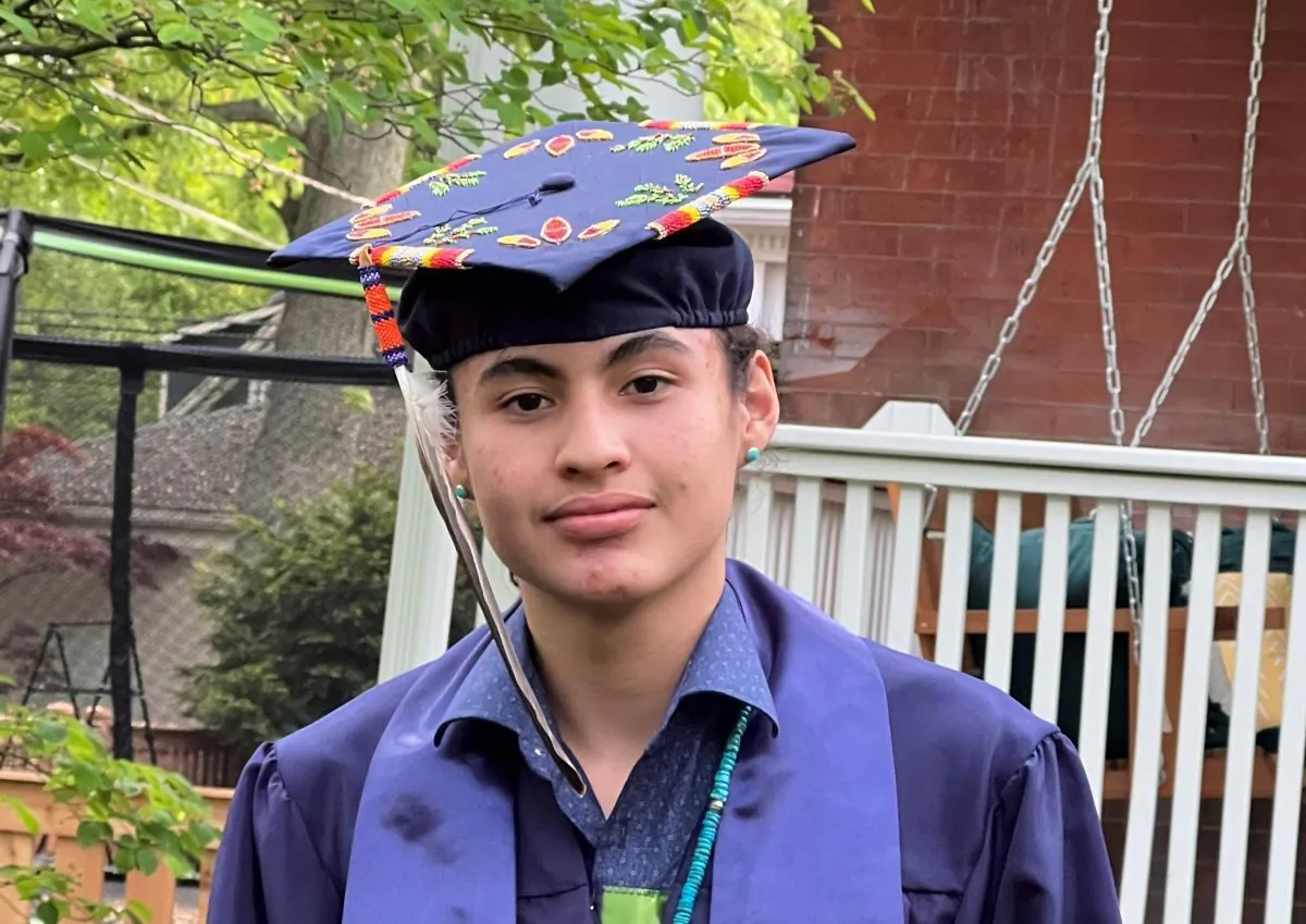 Nimkii Curley, a senior at Evanston Township High School in Ill., was denied the opportunity to walk with his class because he refused to remove religious decorations honoring his Native American heritage from his graduation regalia. (Courtesy of Megan Bang)