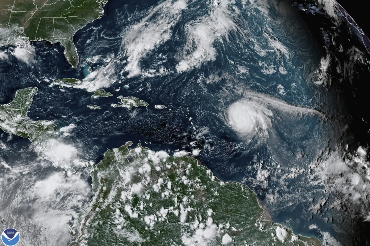 Hurricane Sam (center R) in the Atlantic Ocean on Sept. 27, 2021, at 3:20 p.m. ET, in a satellite image. (NOAA via AP)