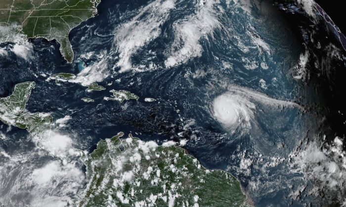 Hurricane Sam (center R) in the Atlantic Ocean on Sept. 27, 2021, at 3:20 p.m. ET, in a satellite image. (NOAA via AP)
