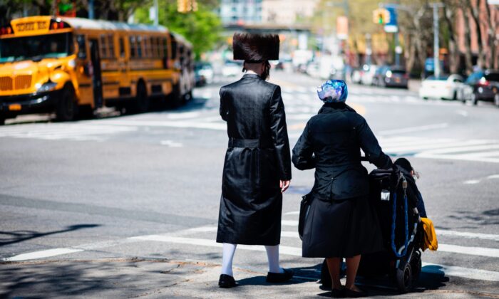 A Jewish family crosses a street in a Jewish quarter in Williamsburg Brooklyn in New York City on April 24, 2019. (Johannes Eisele/AFP via Getty Images)