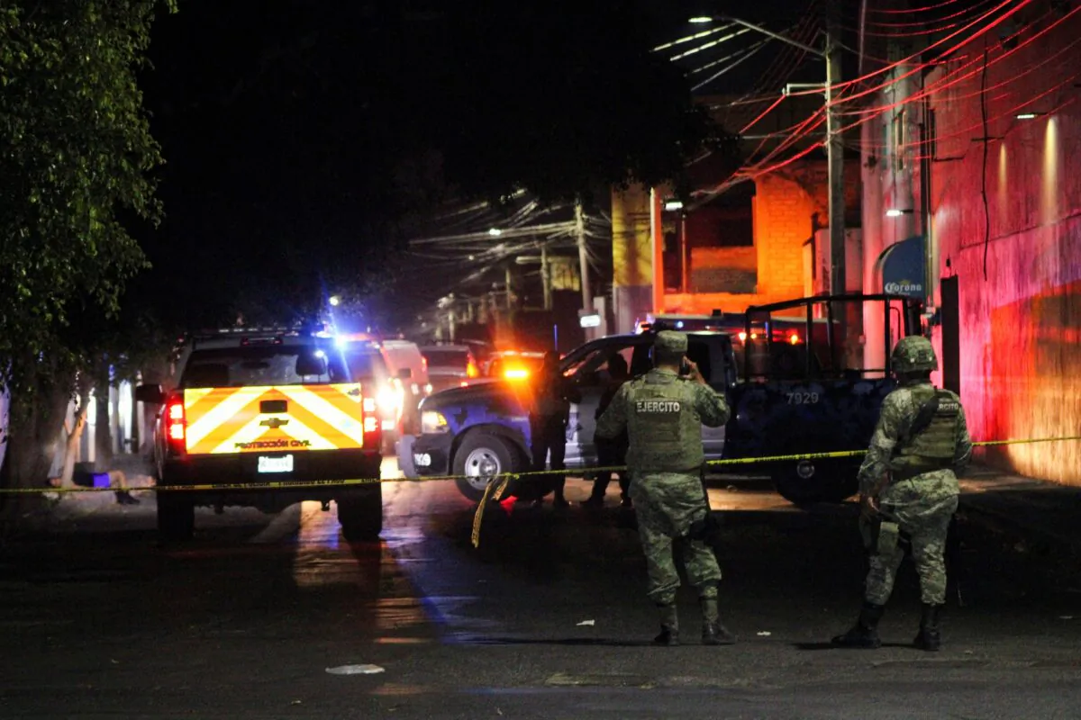 Soldiers guard the scene where gunmen opened fire in two bars killing at least 10 people, in Celaya, Mexico, on May 23, 2022. (Juan Moreno/Reuters)