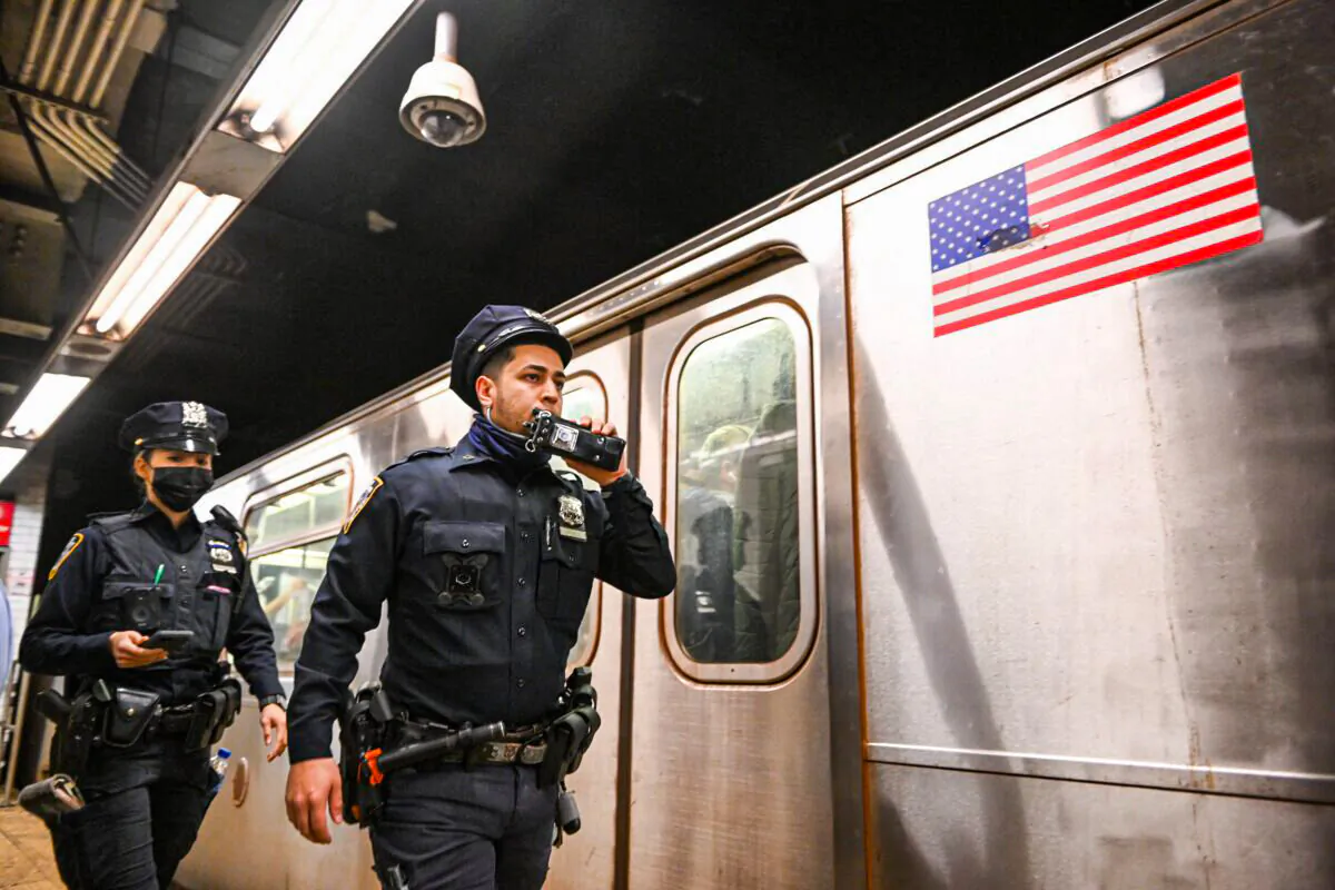 NYPD investigate an incident at a subway station in New York on April 12, 2022. (Alexi J. Rosenfeld/Getty Images)