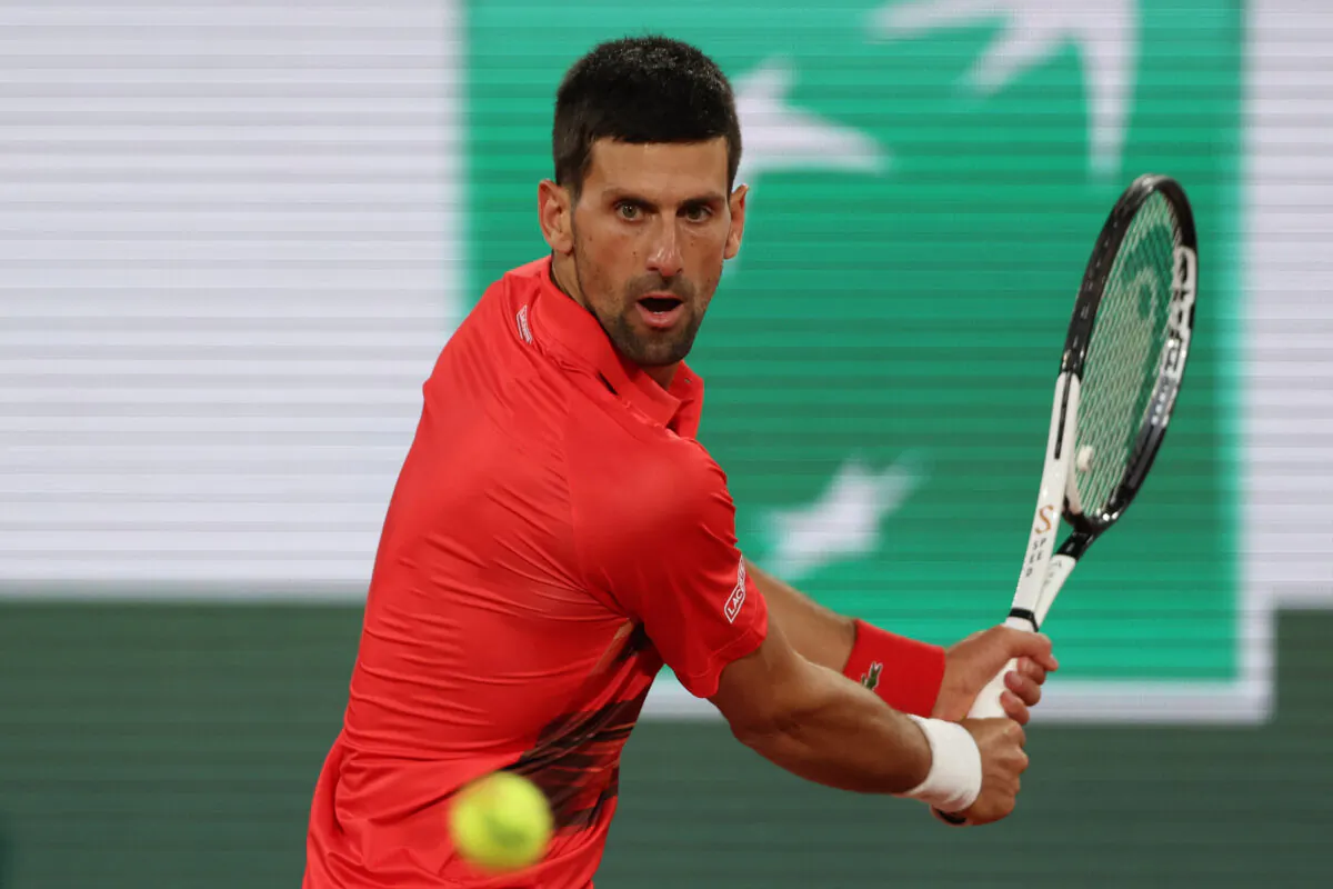 Serbia's Novak Djokovic returns the ball to Japan's Yoshihito Nishioka during their men's singles match on day two of the Roland-Garros Open tennis tournament at the Court Philippe-Chatrier in Paris on May 23, 2022. (Thomas Samson/AFP via Getty Images)