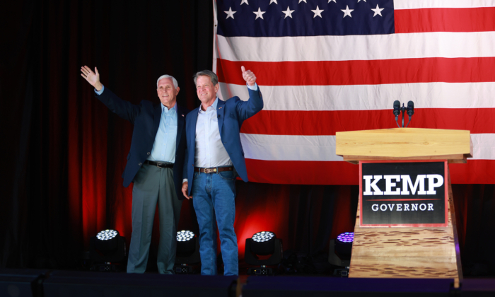 Georgia Gov. Brian Kemp (R) stands with former U.S. Vice President Mike Pence at a campaign event at the Cobb County International Airport on May 23, 2022 in Kennesaw, Georgia. Kemp is running for reelection against former U.S Sen. David Perdue in tomorrow's Republican gubernatorial primary.  (Joe Raedle/Getty Images)