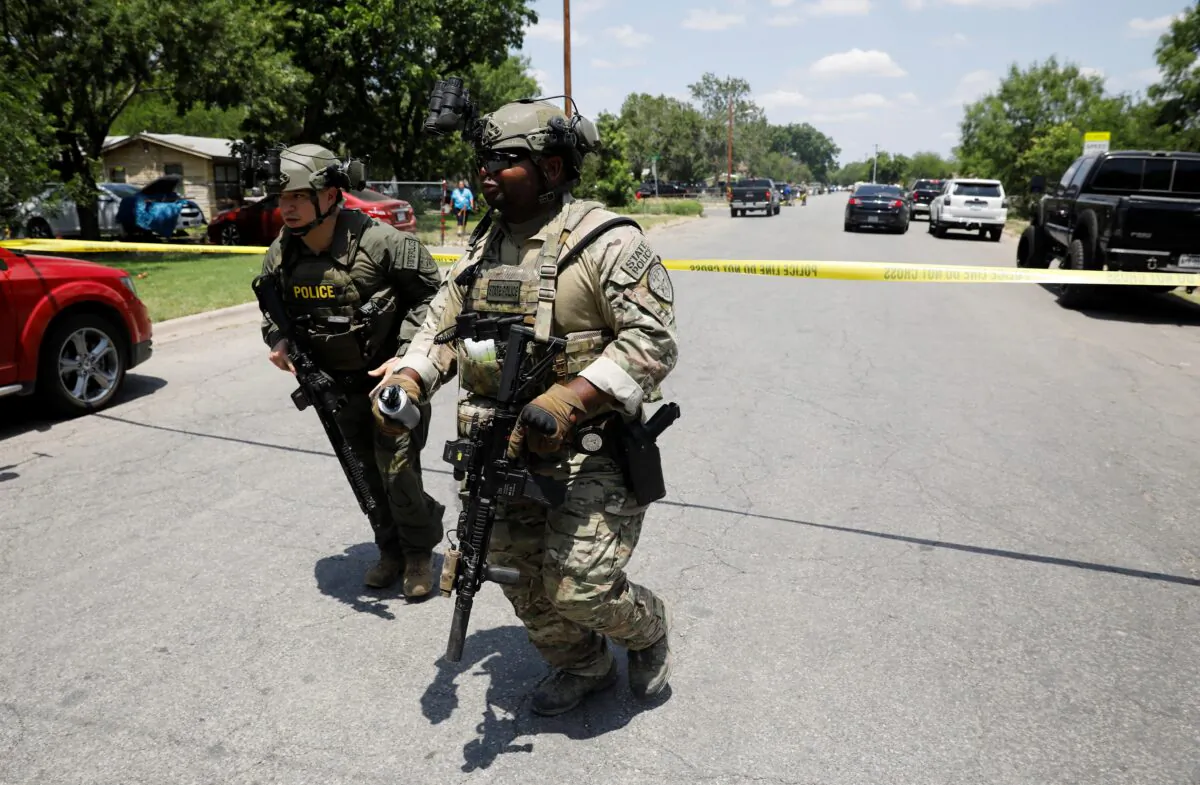 Law enforcement personnel guard the scene of a shooting at Robb Elementary School in Uvalde, Texas, on May 24, 2022. (Marco Bello/Reuters)