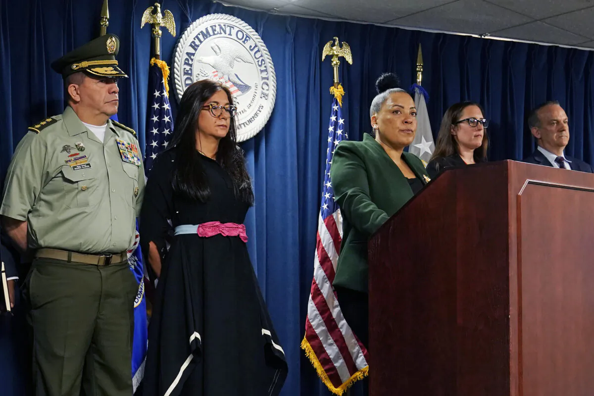 Attorney Rachael Rollins of the Massachusetts District (C) addresses the media at the Moakley Federal Courthouse in Boston, on May 24, 2022. (Charles Krupa/AP Photo)
