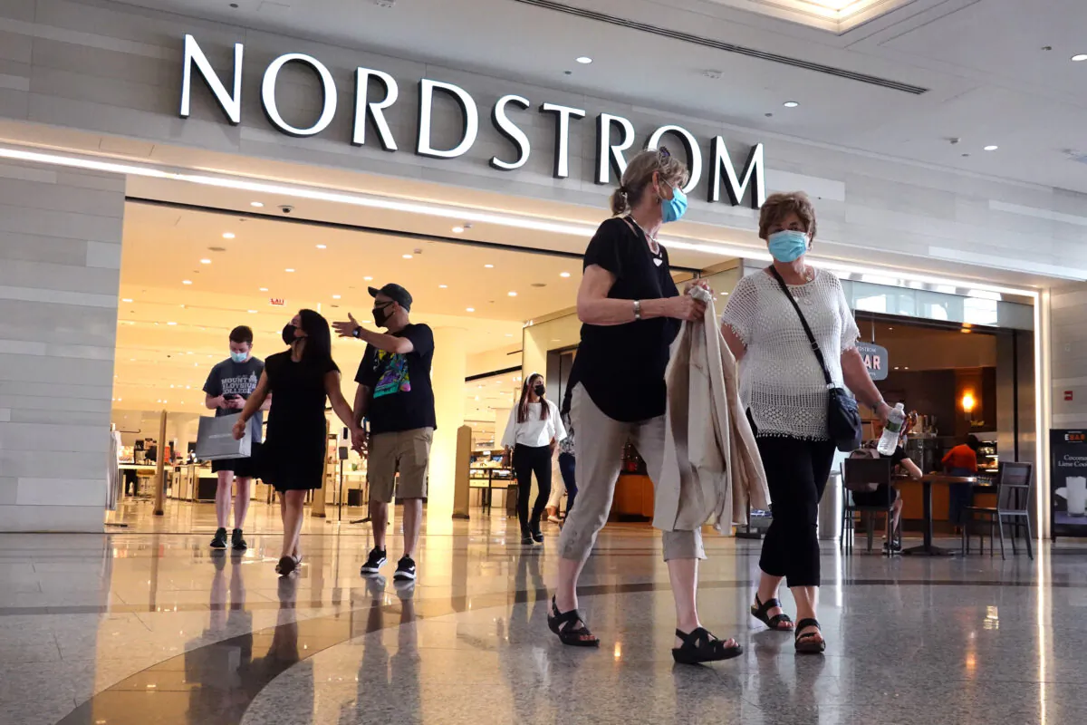 Shoppers leave a Nordstrom store in Chicago, on May 26, 2021. (Scott Olson/Getty Images)