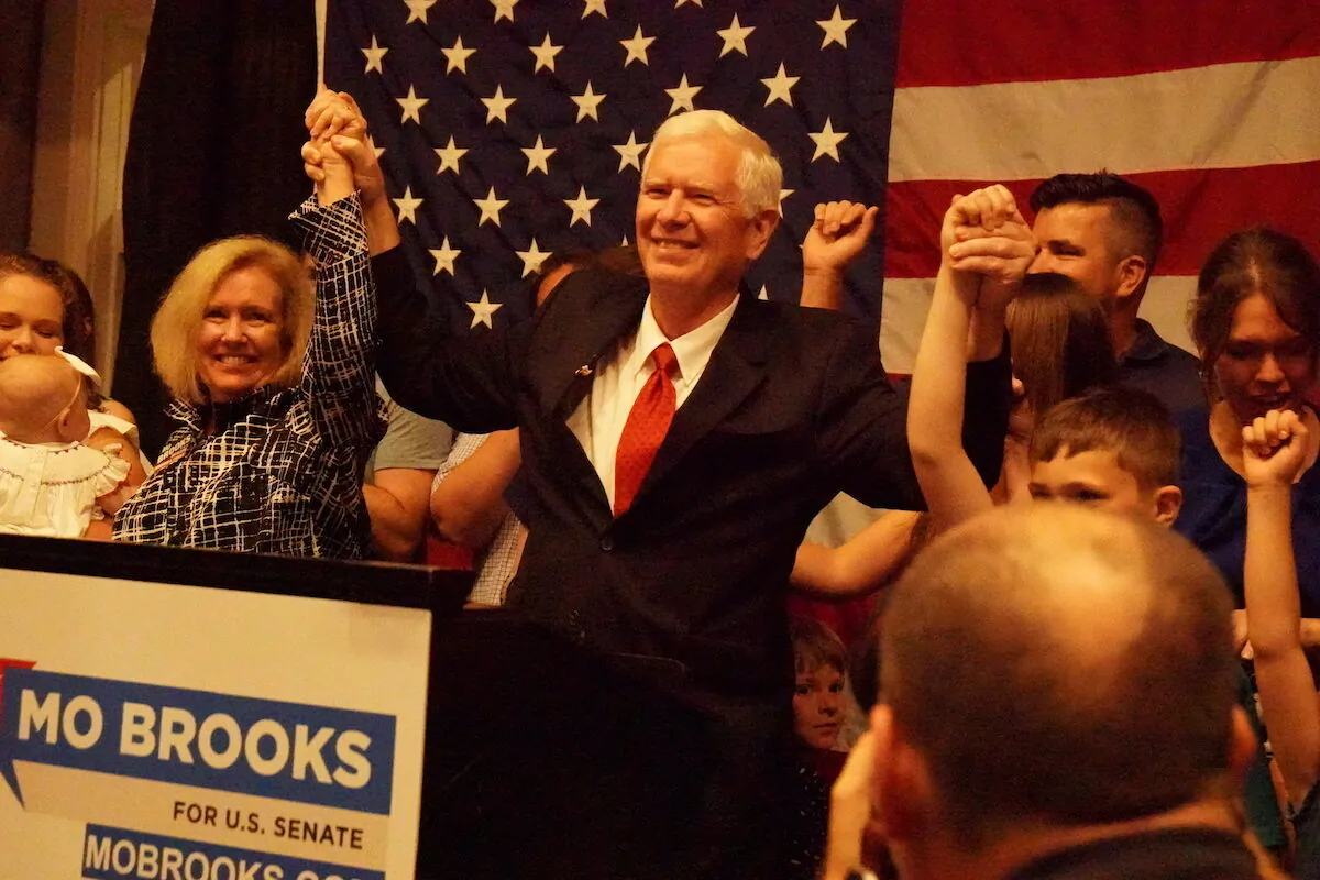 Rep. Mo Brooks (R) celebrates with his family after entering a runoff election against candidate Katie Britt in Huntsville, Alabama on May 24, 2022 (Jackson Elliott/The Epoch Times)