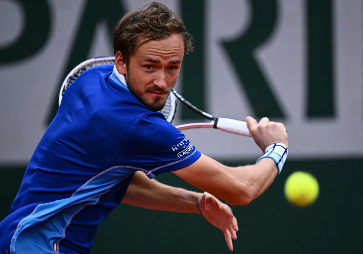 Russia's Daniil Medvedev returns the ball to Argentina's Facundo Bagnis during their men's singles match on day three of the Roland-Garros Open tennis tournament at the Court Suzanne-Lenglen in Paris on May 24, 2022. (Anne-Christine Poujoulat/AFP via Getty Images)